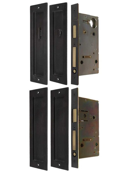 Solid Bronze Double Pocket Door Mortise-Lock Set with Rectangular Pulls.